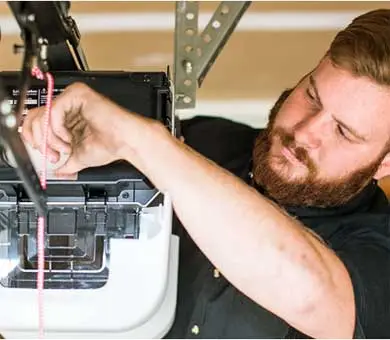 garage door safety sensor repair Odessa TX close-up track installation