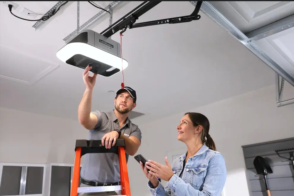 Technician repairing a garage door opener motor after the garage door opener stopped working.