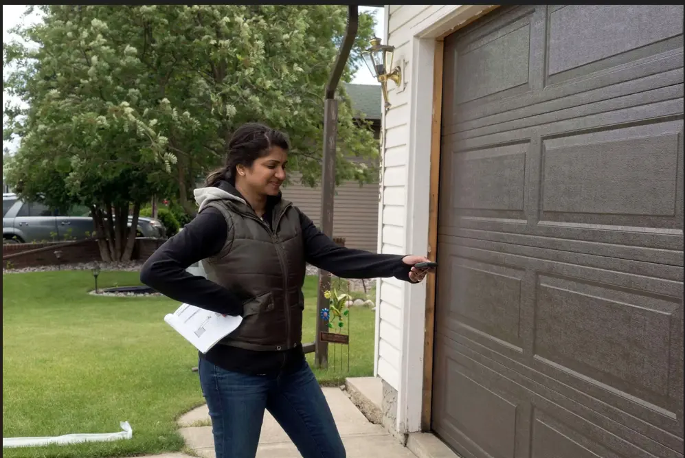 Homeowner in Odessa TX trying to open a garage door after the garage door opener stopped working.