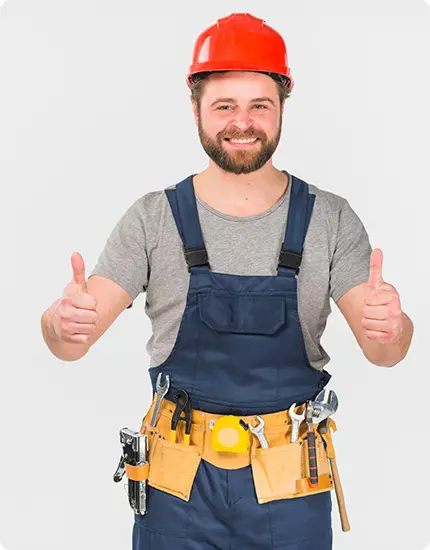 Certified garage door repair technician in Odessa TX giving a thumbs-up while wearing safety gear and a tool belt.